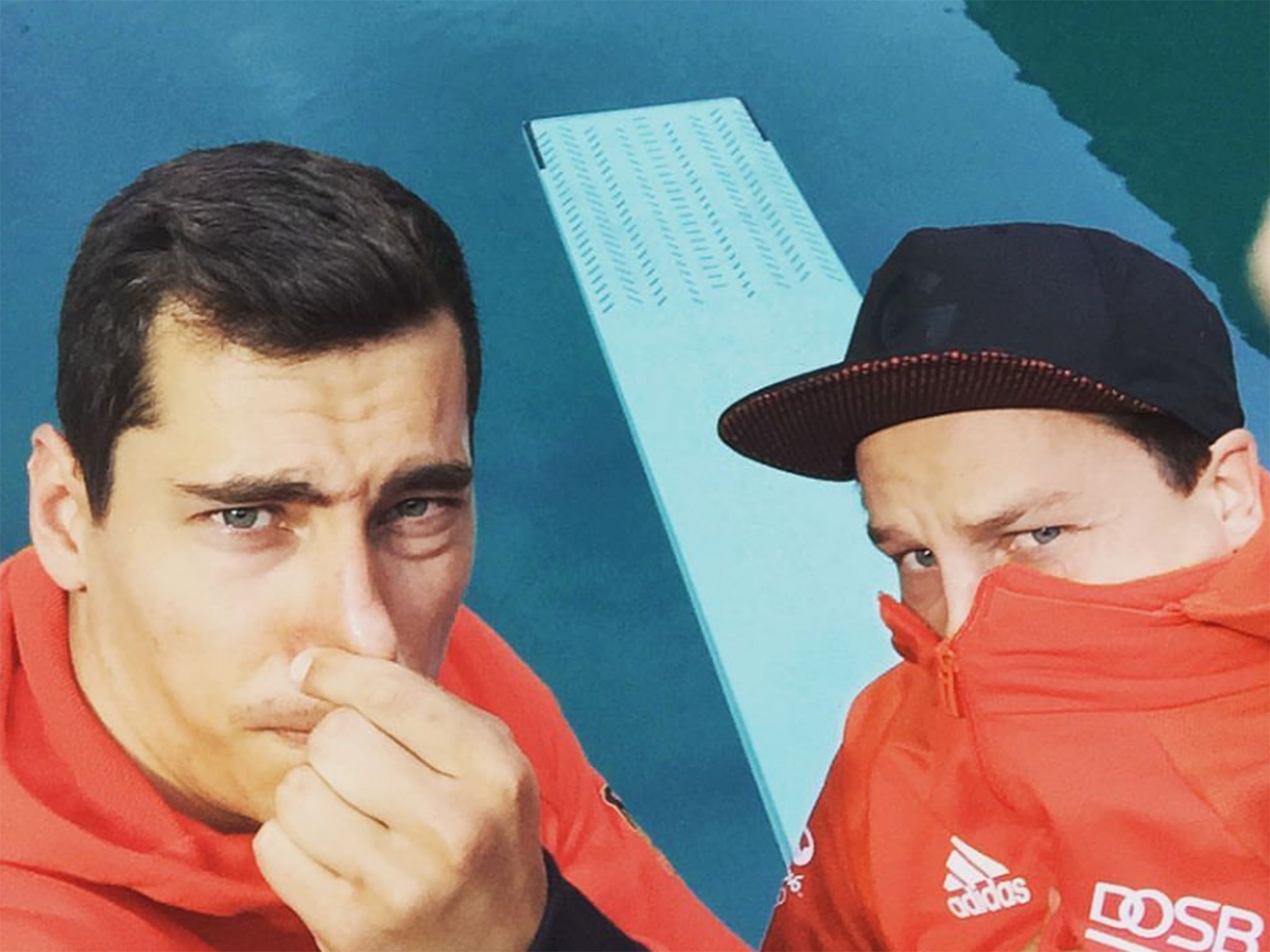 Feck and a team-mate hold their noses at the Maria Lenk Aquatics Centre