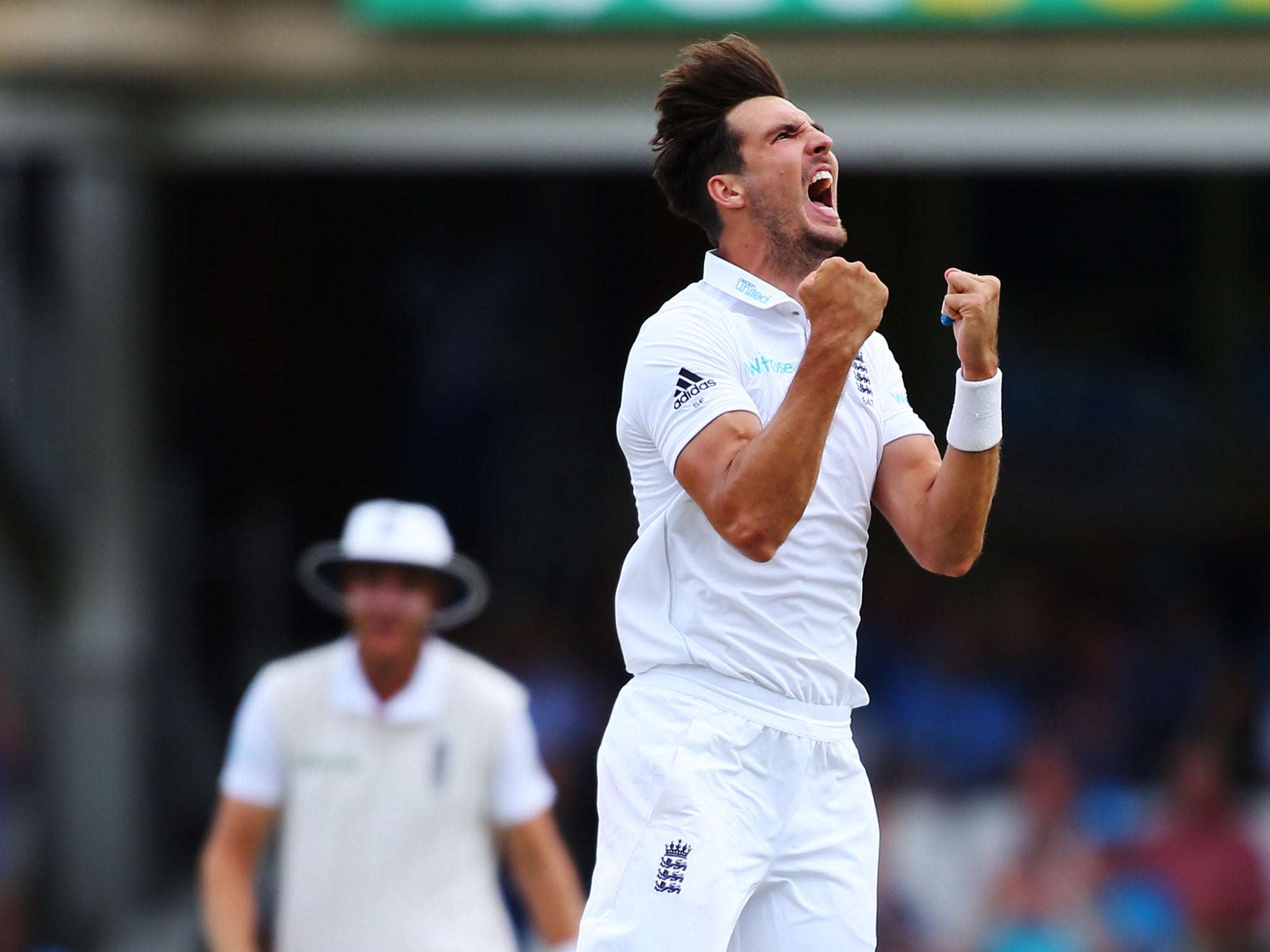 Steven Finn celebrates prematurely after believing he has dismissed Khan