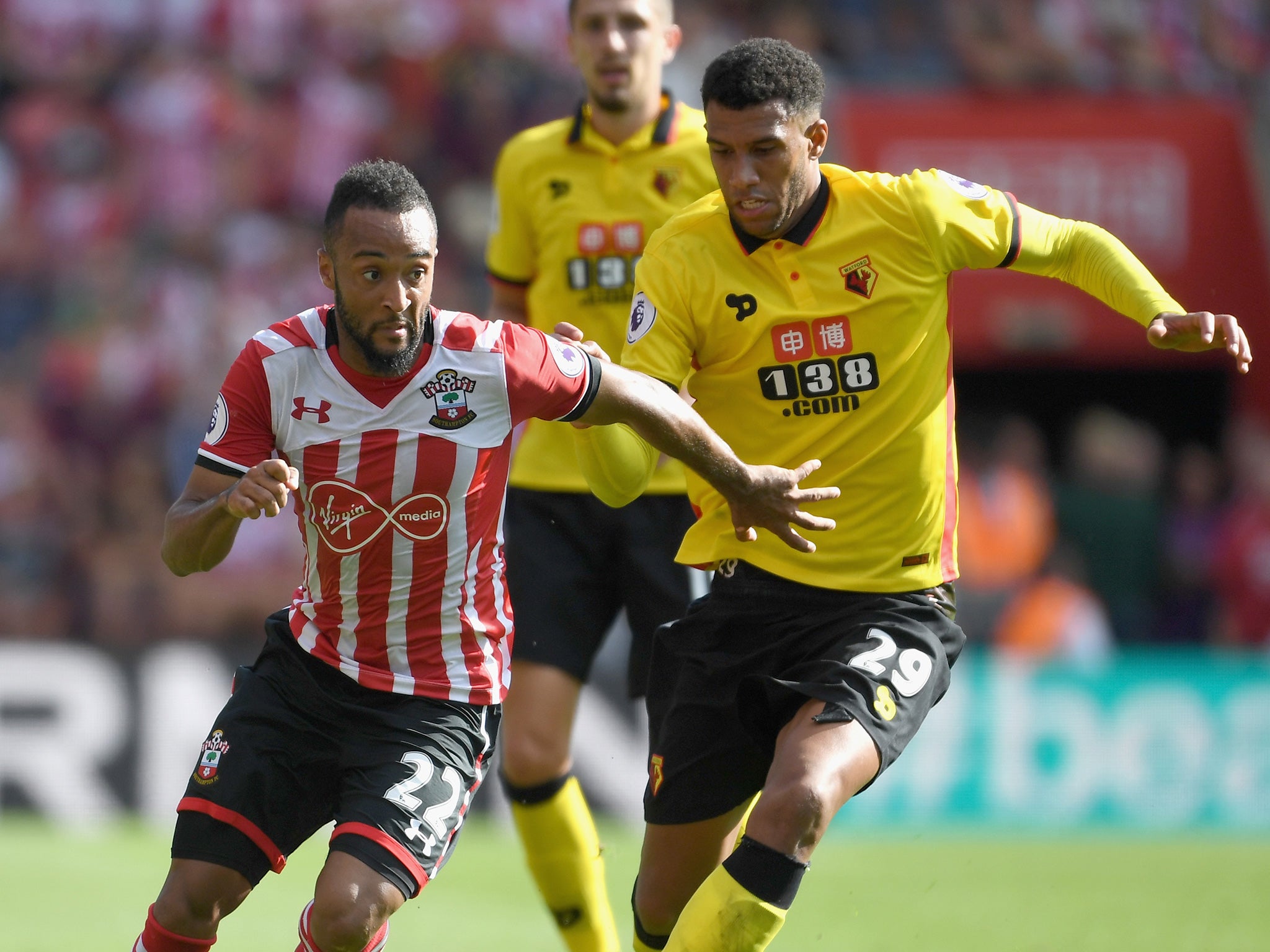 The day's two scorers, Capoue and Redmond, battle for the ball
