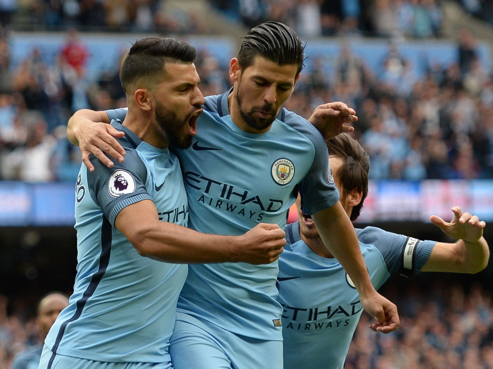 Sergio Aguero celebrates with Nolito after scoring a penalty against Sunderland