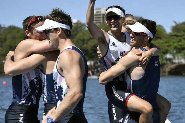 Members of Team GB's men's eight celebrate their gold medal success