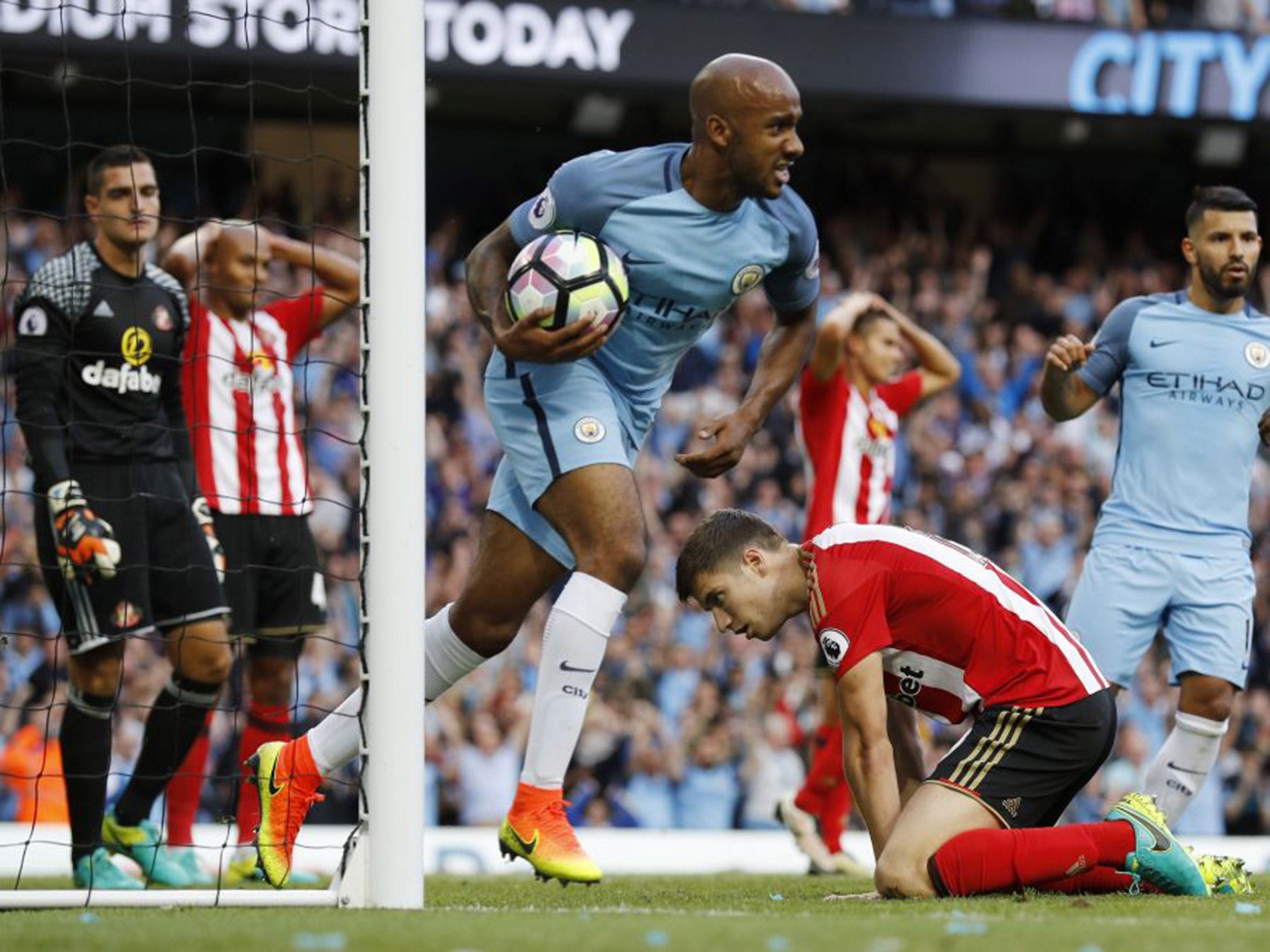 Fabian Delph peels away in celebration after Paddy McNair's own goal sealed Manchester City victory