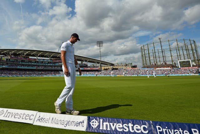 England's Steven Finn fields during play on the third day of the fourth test cricket match
