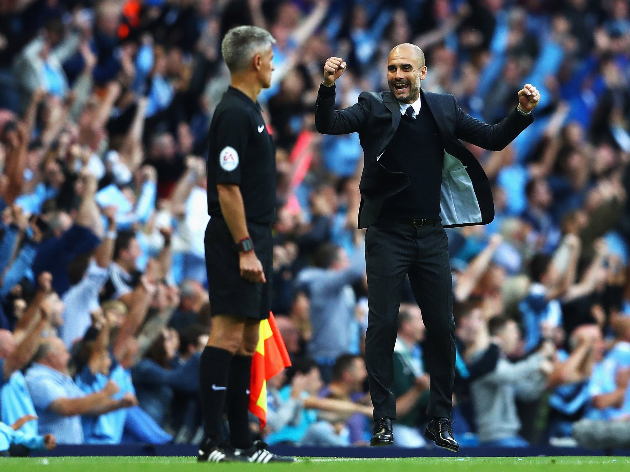Pep Guardiola celebrates after Paddy McNair's own-goal gave Manchester City victory over Sunderland