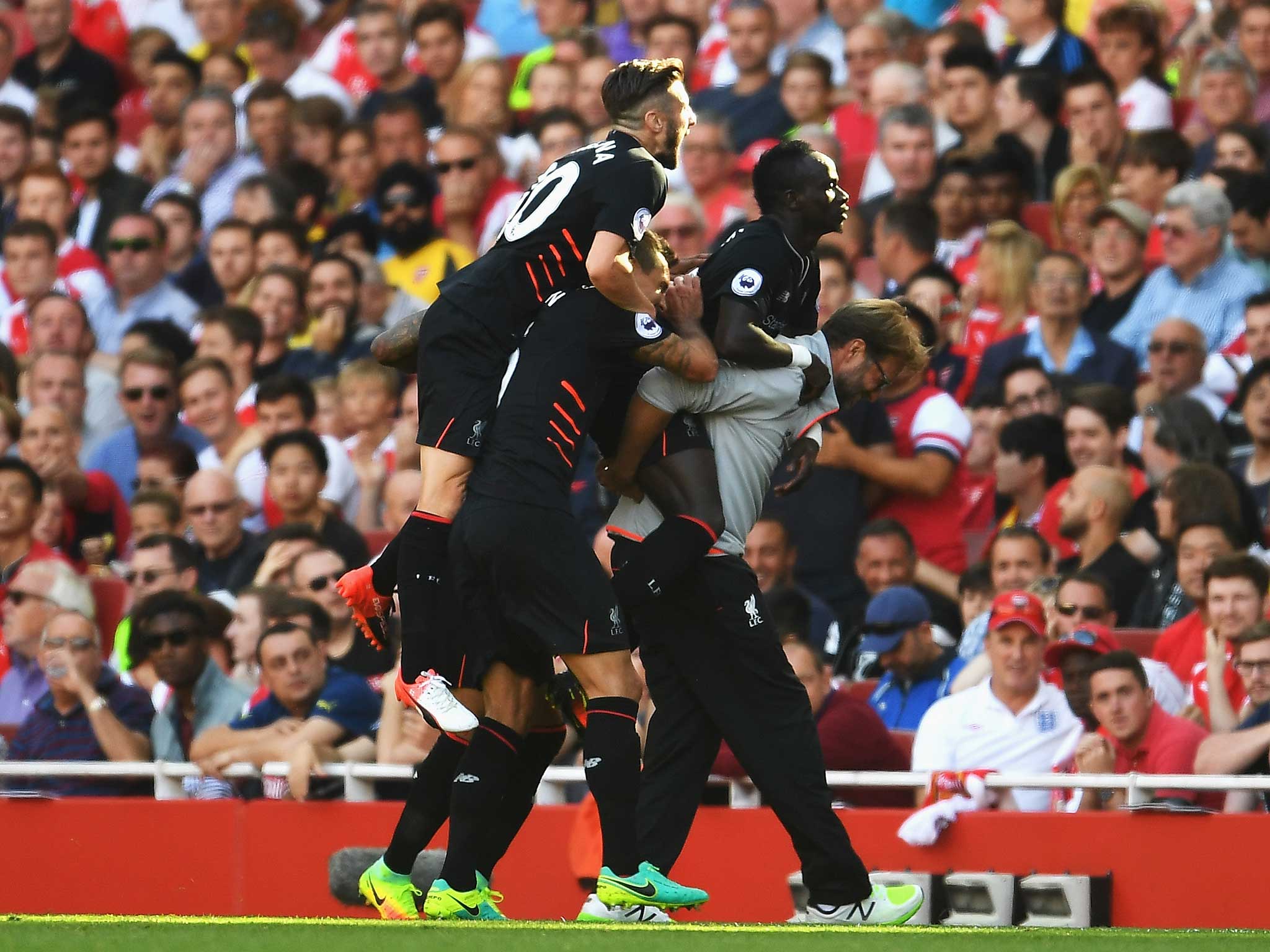 Sadio Mane celebrates Liverpool's fourth goal with manager Jurgen Klopp