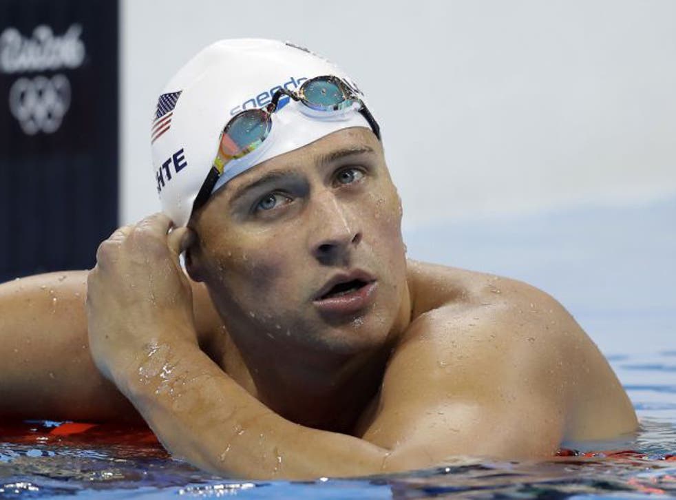 United States' Ryan Lochte checks his time in a men's 4x200-meter freestyle heat