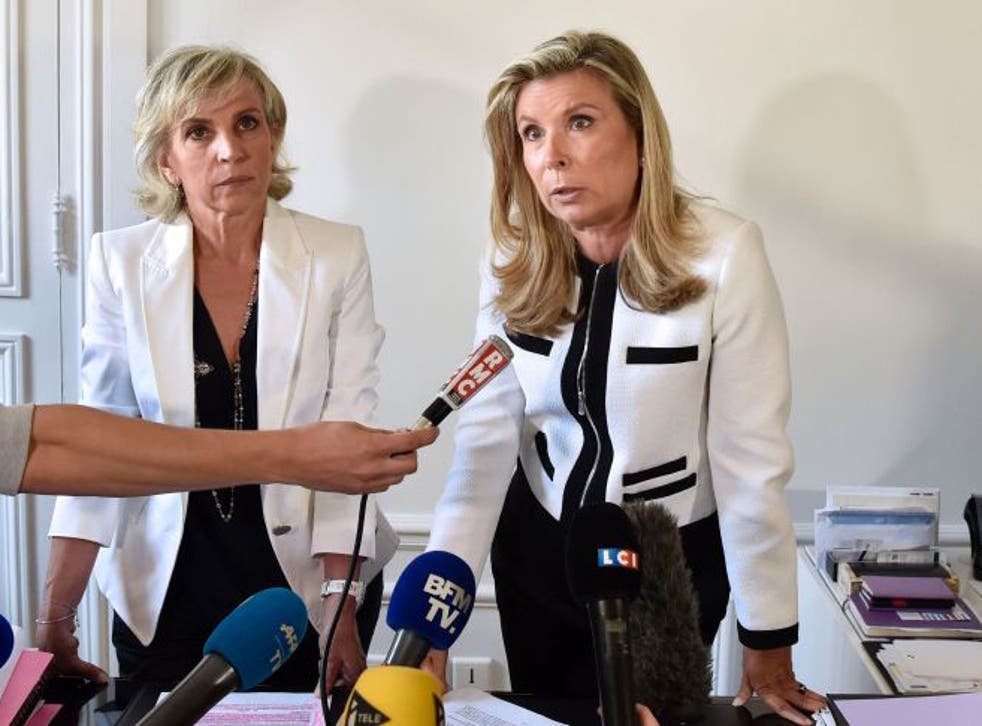 Janine Bonaggiunta (L) and Nathalie Tomasini (R), lawyers representing Jacqueline Sauvage, a woman convicted of the murder of her husband