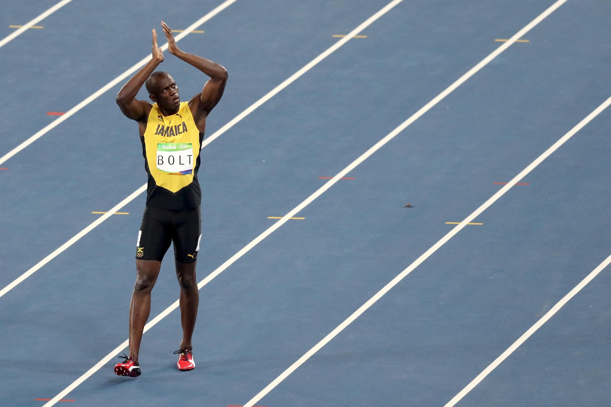 Usain Bolt wins his third consecutive Olympic gold medal in the men's 100m