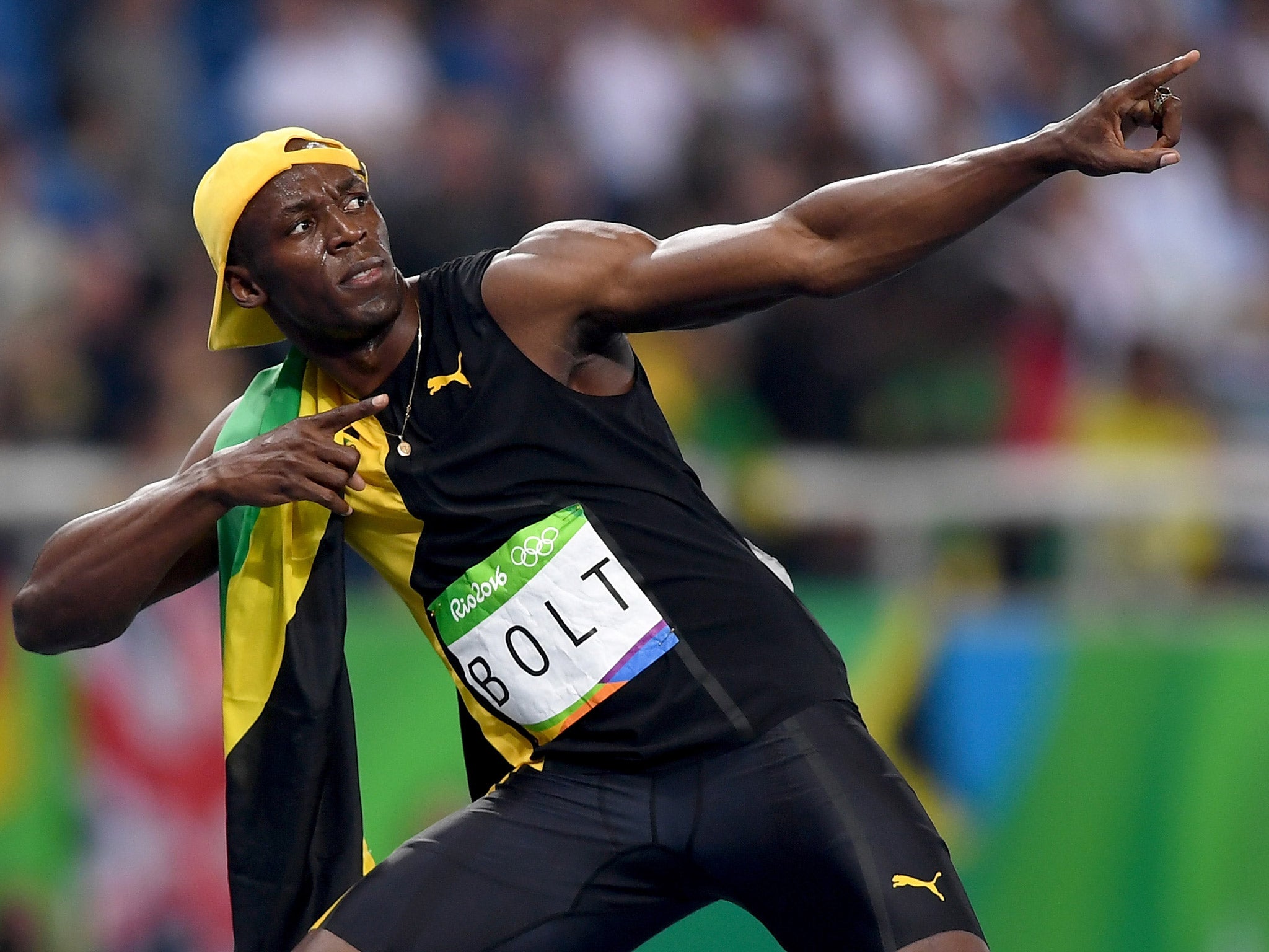 Usain Bolt celebrates winning the 100m Olympic final