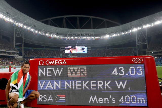 Wayde van Niekerk celebrates his world record time in winning gold in the 400m final