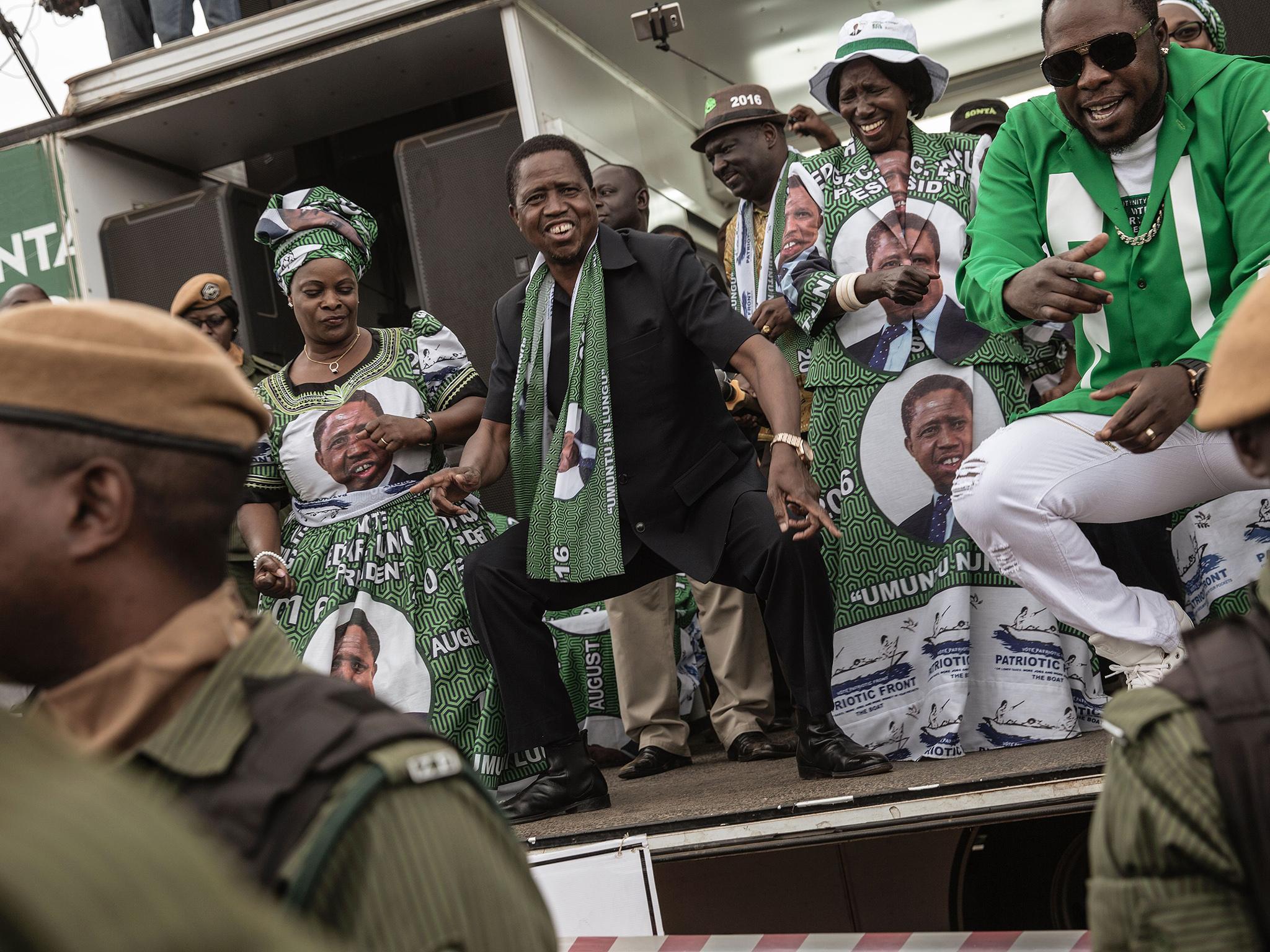 Zambian President Edward Lungu dances before delivering a speech during his presidential campaign closing rally (AFP/Getty)