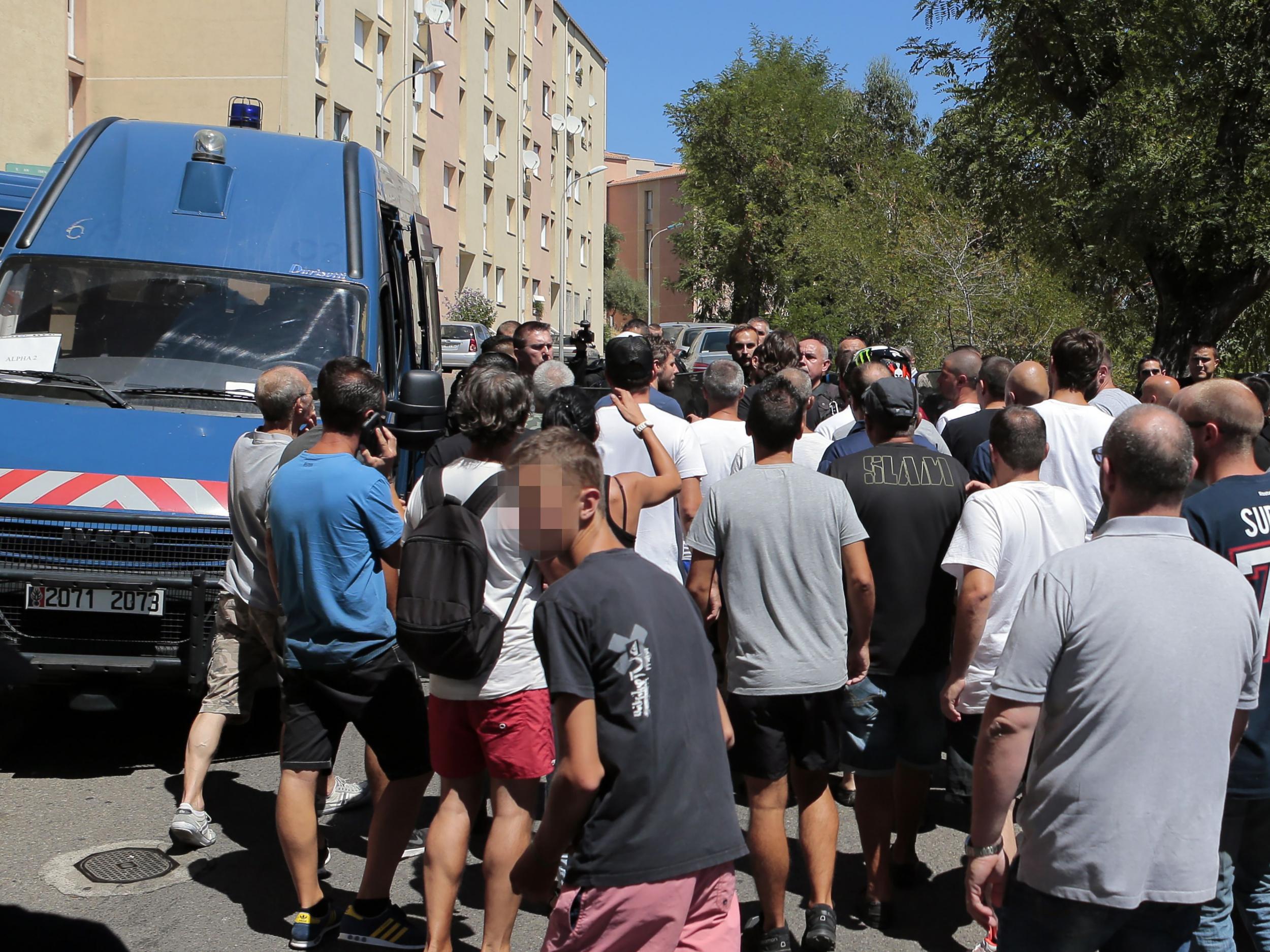 Approximately 500 people gathered on Sunday morning at a housing estate in Bastia's Lupino neighbourhood (AFP )