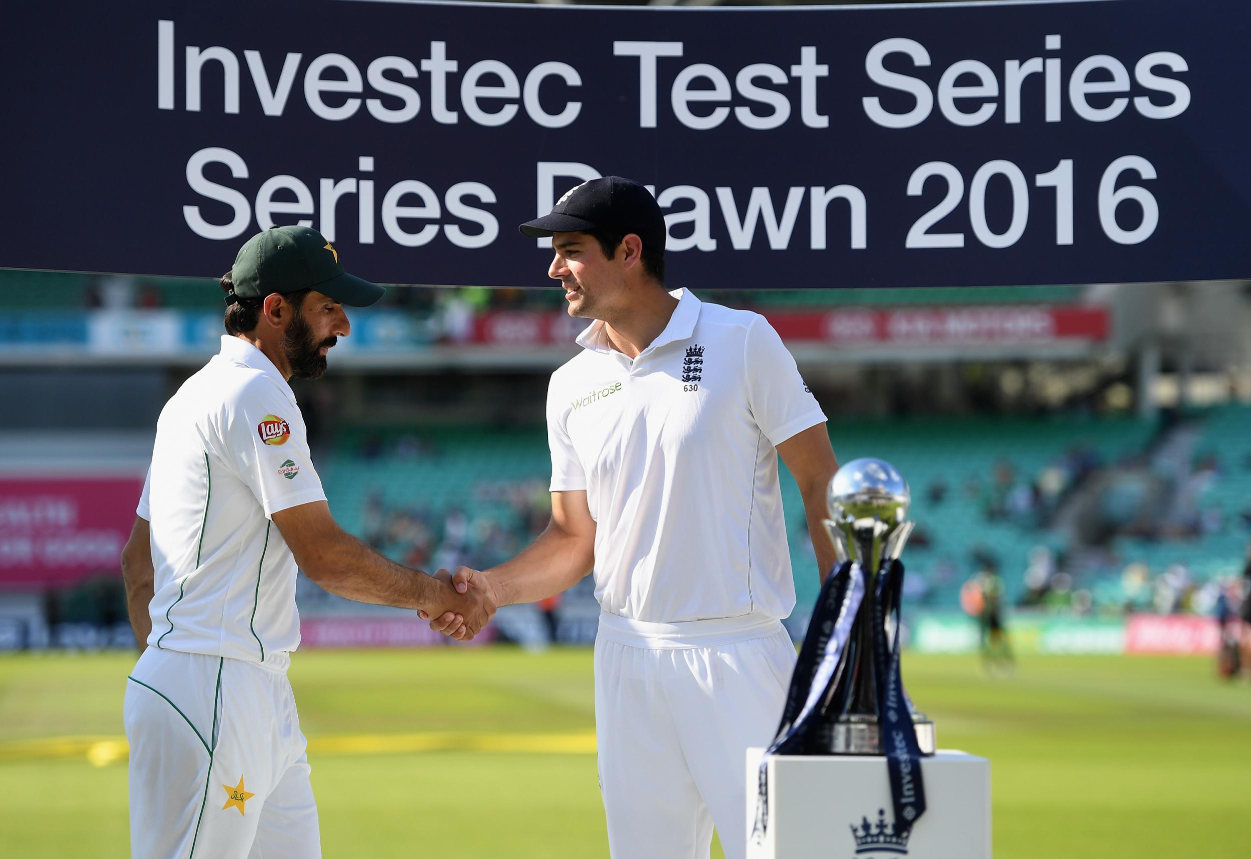 Pakistan captain Misbah-ul-Haq and England captain Alastair Cook share the series trophy after the 4th Investec Test