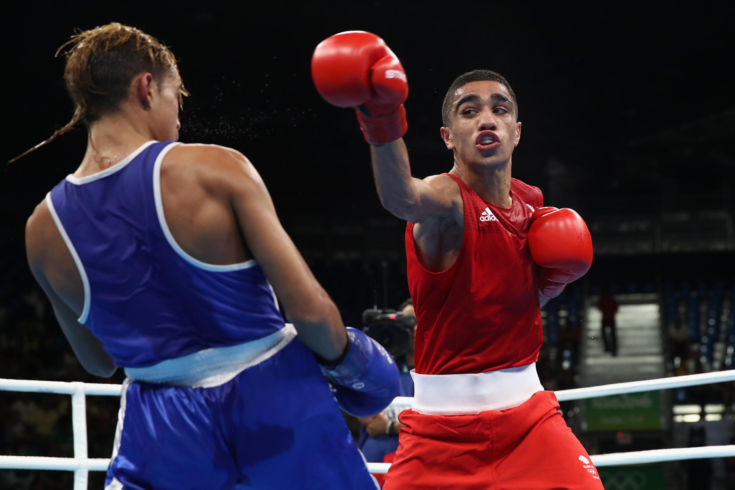 Muhammad Ali of Great Britain fights Yoel Segundo Finol of Venezuala in the men's Flyweight 52kg
