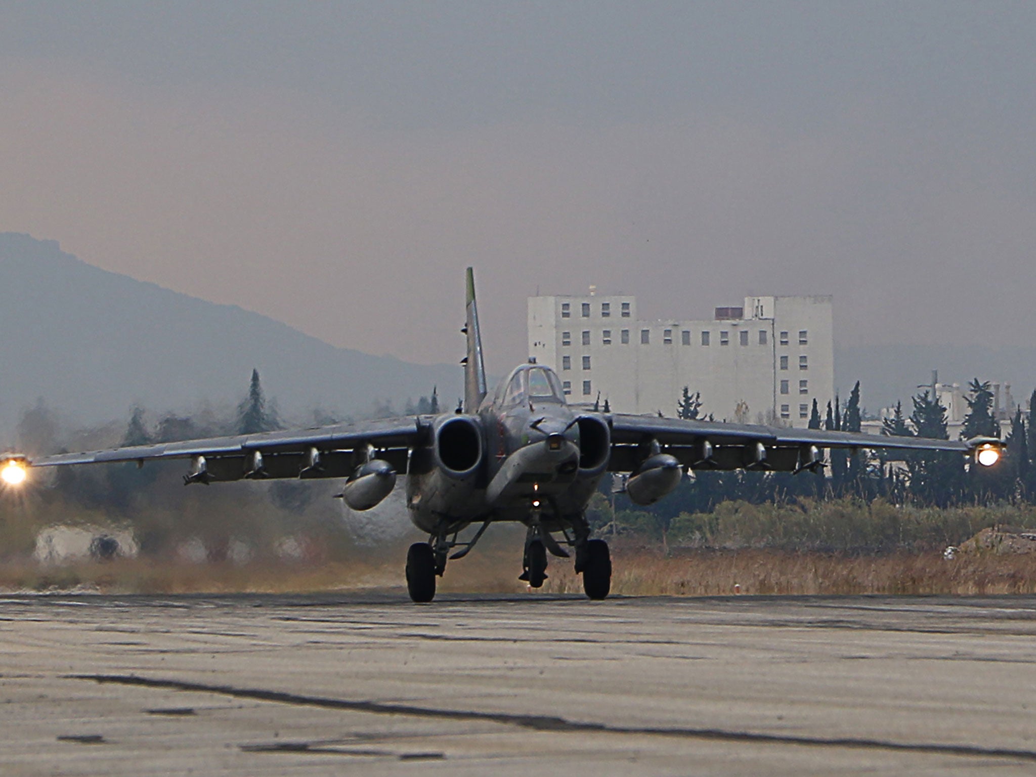 A Russian Sukhoi Su-34 bomber lands at the Russian Hmeimim military base in Latakia province, in the northwest of Syria, on December 16, 2015.