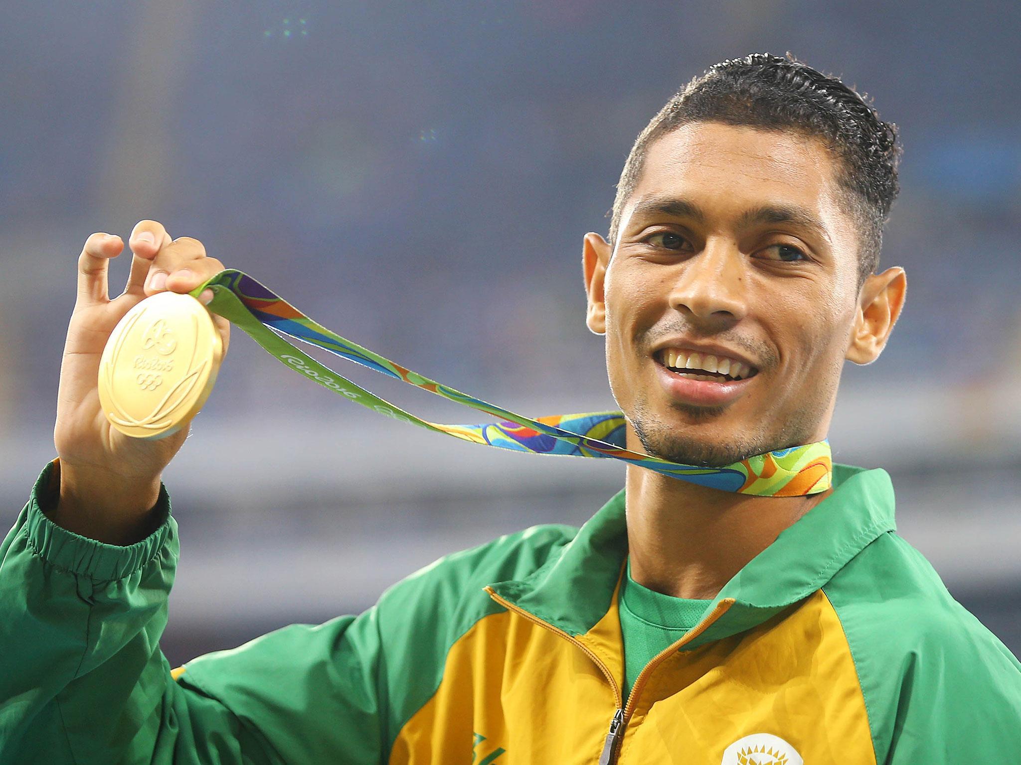 Gold medalist Wayde van Niekerk of South Africa poses with his medal after breaking the 400m world record
