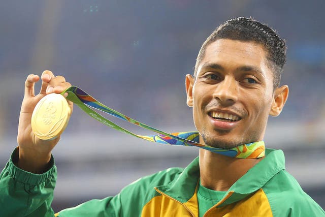 Gold medalist Wayde van Niekerk of South Africa poses with his medal after breaking the 400m world record