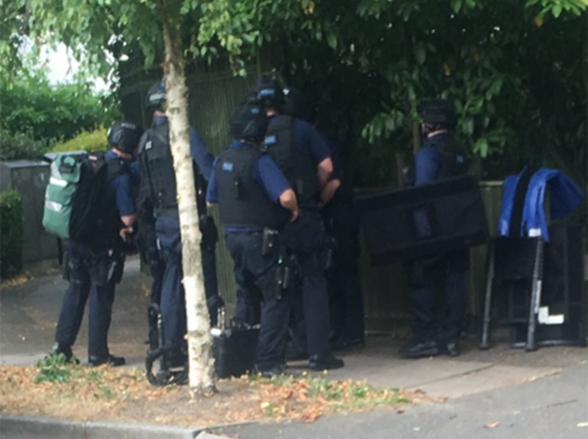 Armed police officers spotted outside a property in Wimbledon, south west London