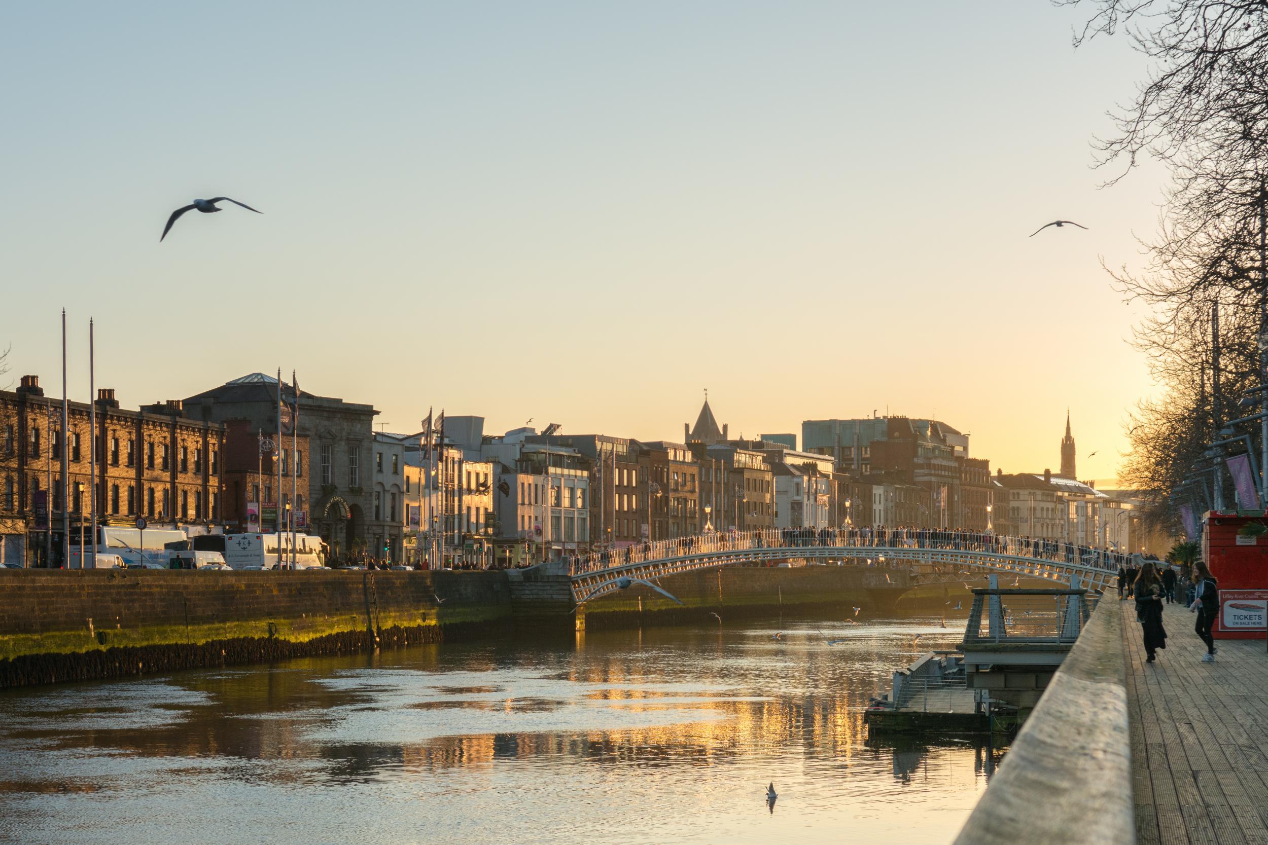 The sun sets over the River Liffey in Dublin, a city with plenty of scenic waterside activities to enjoy
