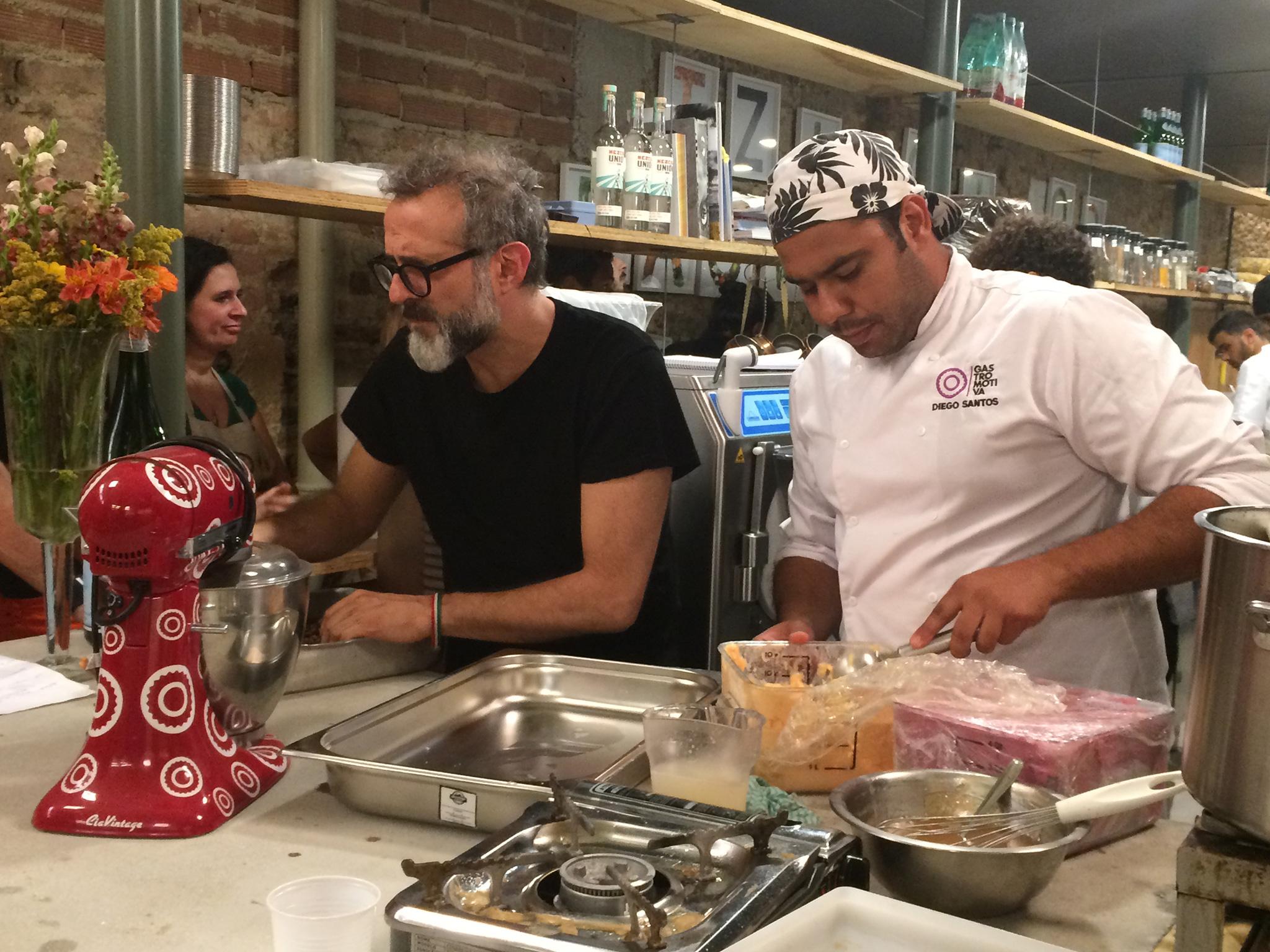 Kitchen staff prepare food at Refettorio Gastromotiva