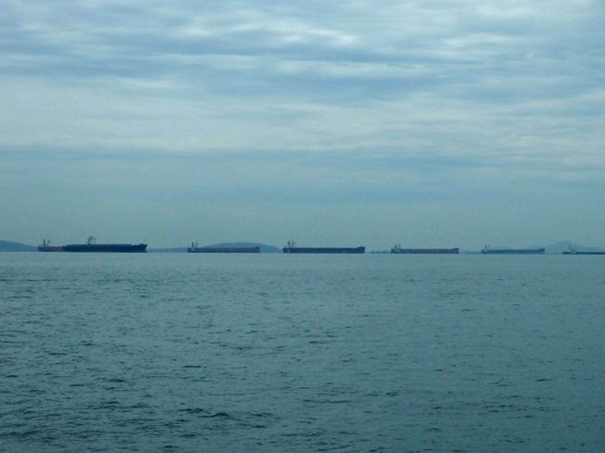 Tankers in the Strait of Singapore. Despite the hijacking a report on the region says the number of piracy incidents is actually going down