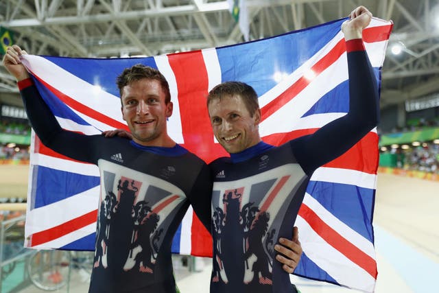 Jason Kenny (R) and Callum Skinner (L) of Great Britain celebrate winning the gold and silver medals in the Men's Sprint on Day 9 of the Rio 2016 Olympic Games at the Rio Olympic Velodrome on August 14,