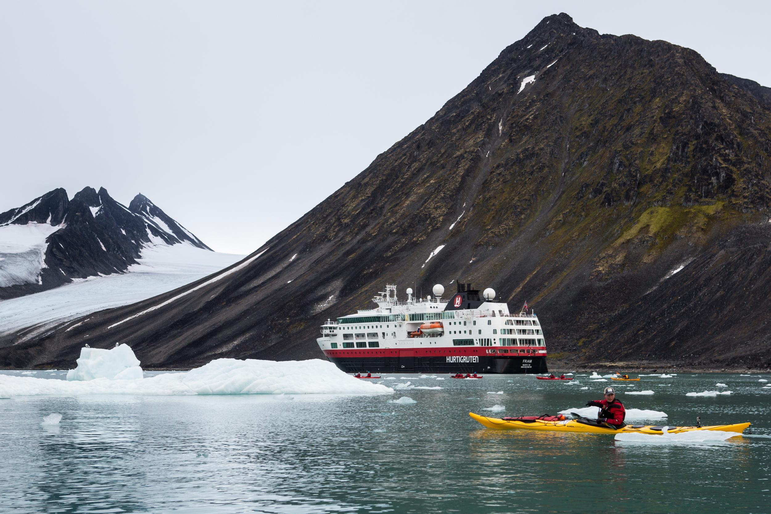 Cruise excursions can include exploring fjords and getting up close to icebergs by kayak