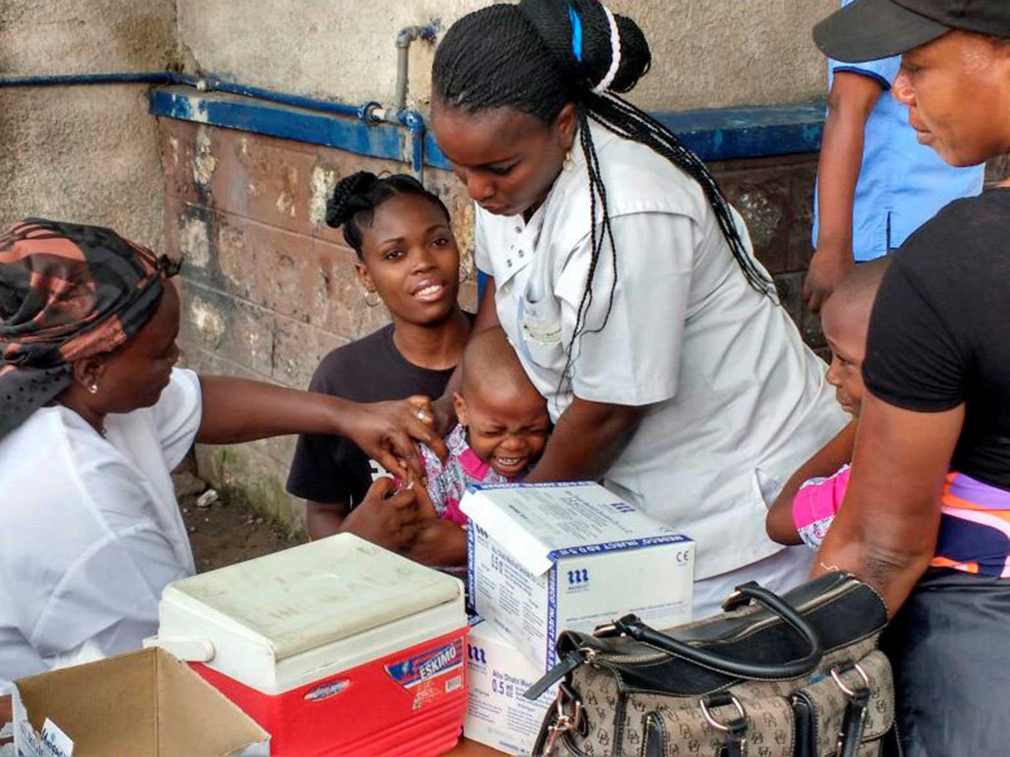 A Congolese child receives vaccination against yellow fever at the Kalembe-Lembe pediatric hospital, in Lingwala district of the Democratic Republic of Congo's capital Kinshasa