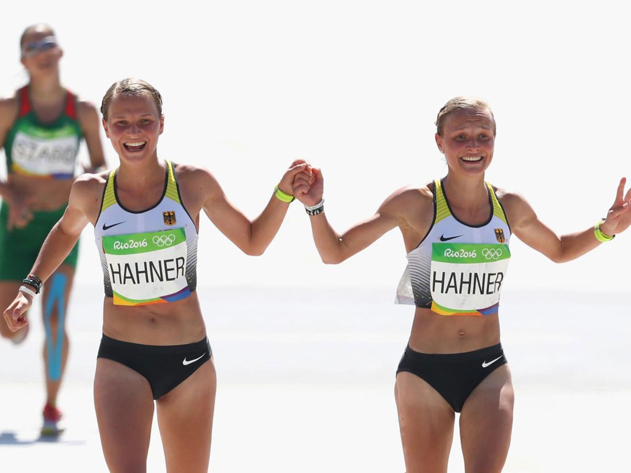 The twins received criticism for joining hands as they approached the finish line