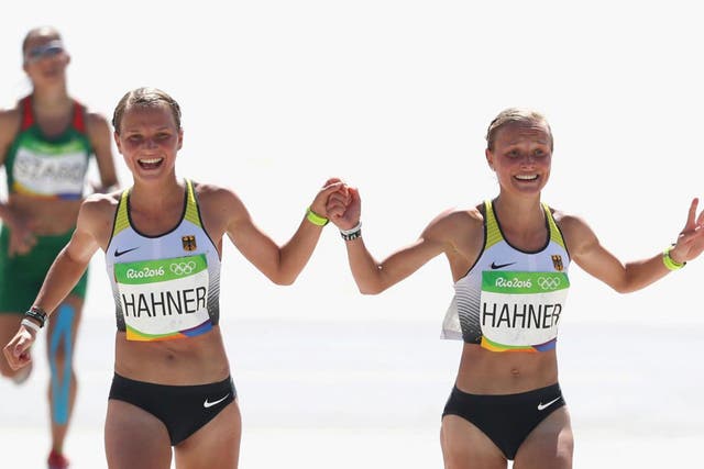 The twins received criticism for joining hands as they approached the finish line