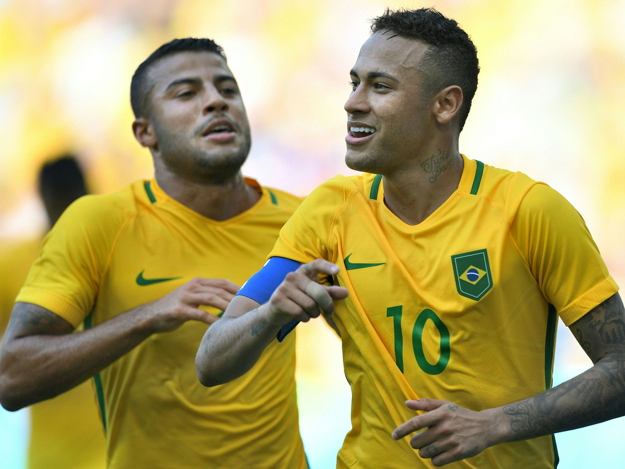 Neymar celebrates wrapping up Brazil's win with a late penalty