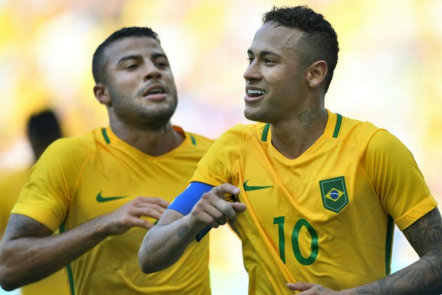 Neymar celebrates wrapping up Brazil's win with a late penalty