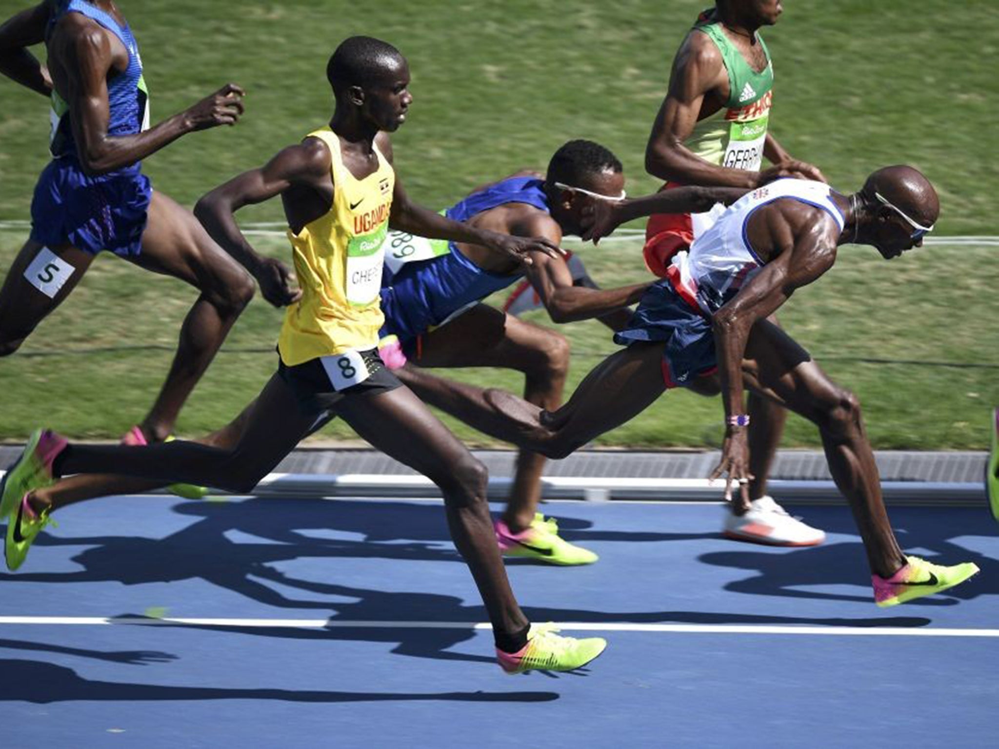 &#13;
Hassan Mead of the US collides with Farah during the 5,000m semi-final &#13;