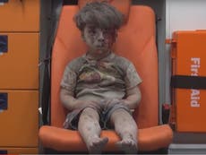 Syria war: UN suspends humanitarian task force as footage of boy hurt in Aleppo air strike provokes outrage