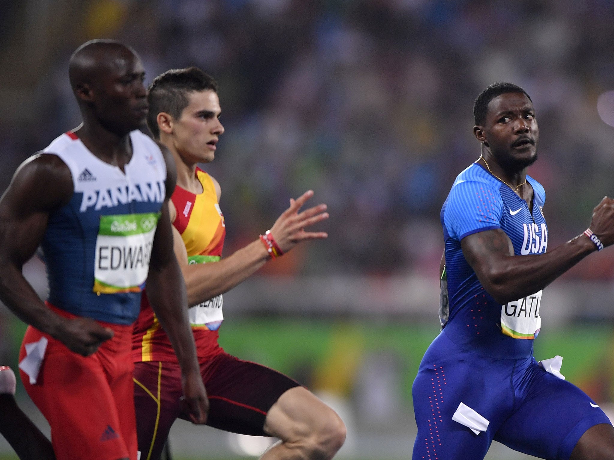 Gatlin looks back across the field at his opponents before the line