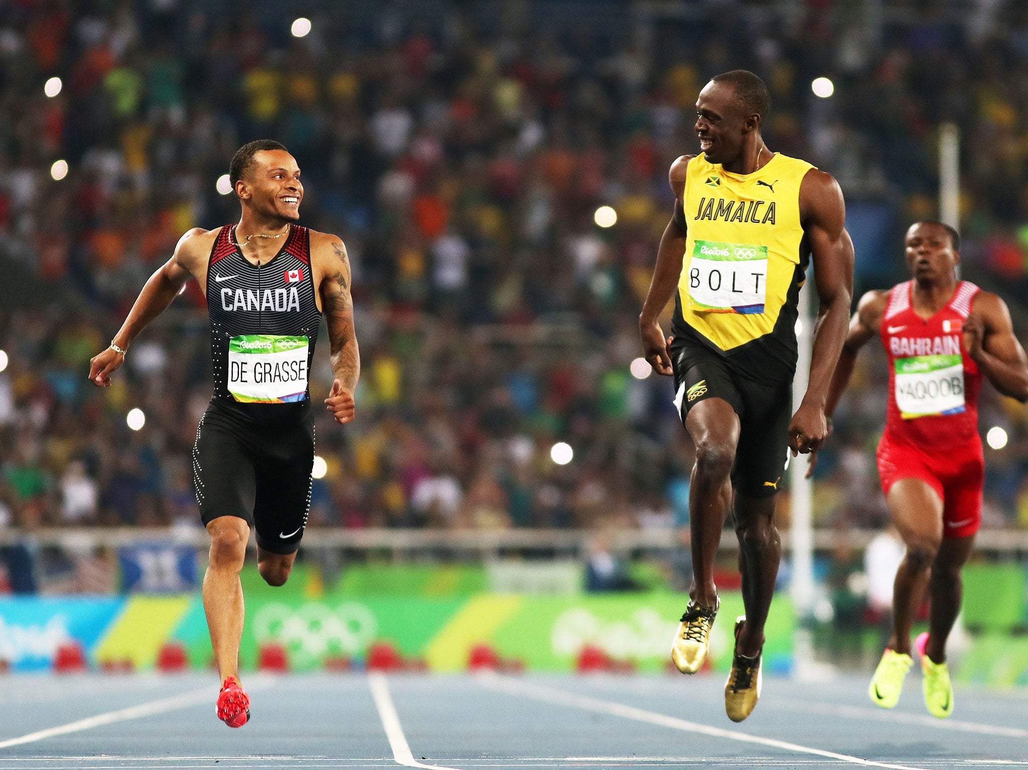 Usain Bolt and Andre de Grasse share a joke in the men's 200m