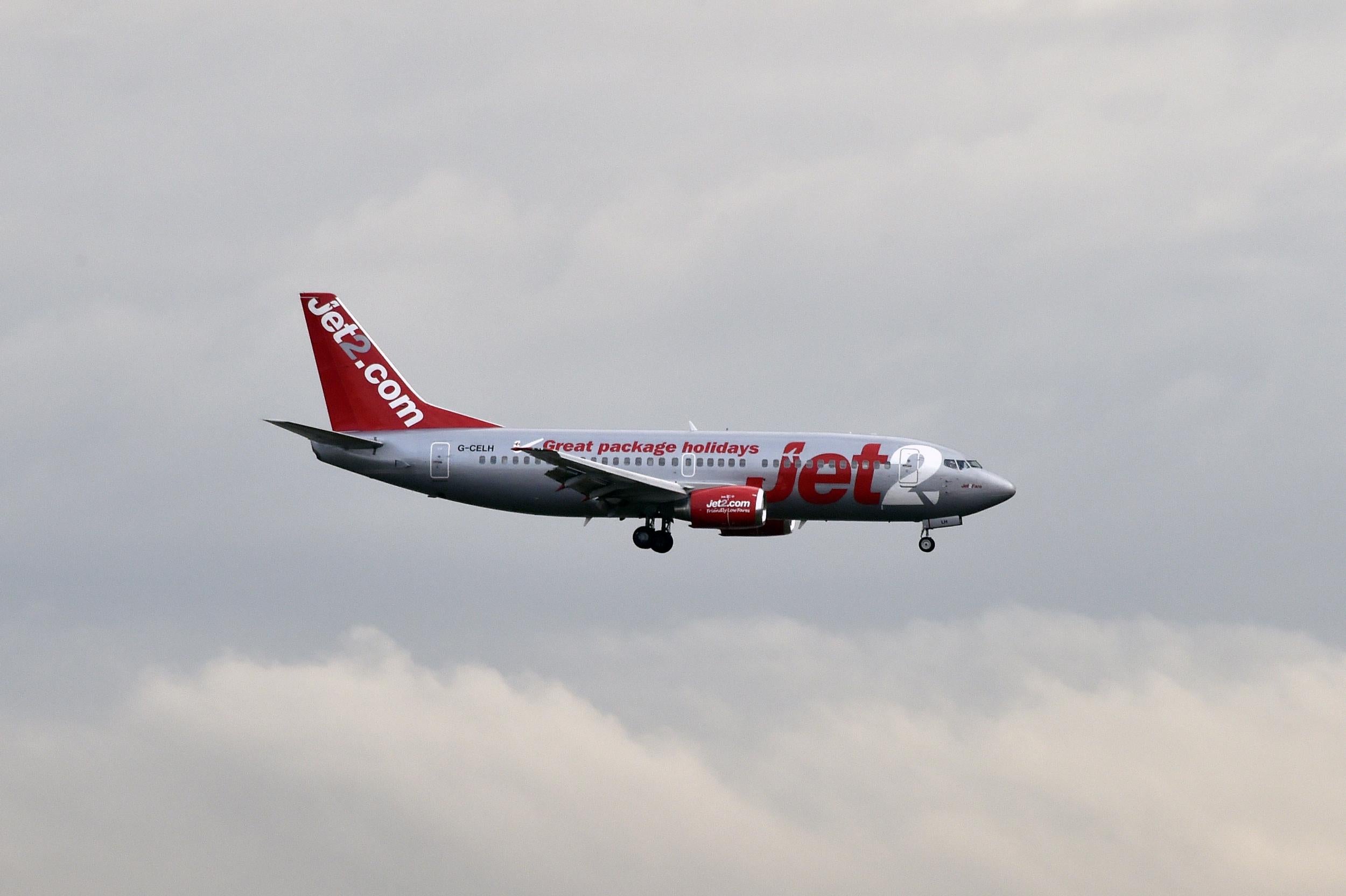 A group of 11 family and friends were forced to sit beside a pool of sick on a Jet2 flight