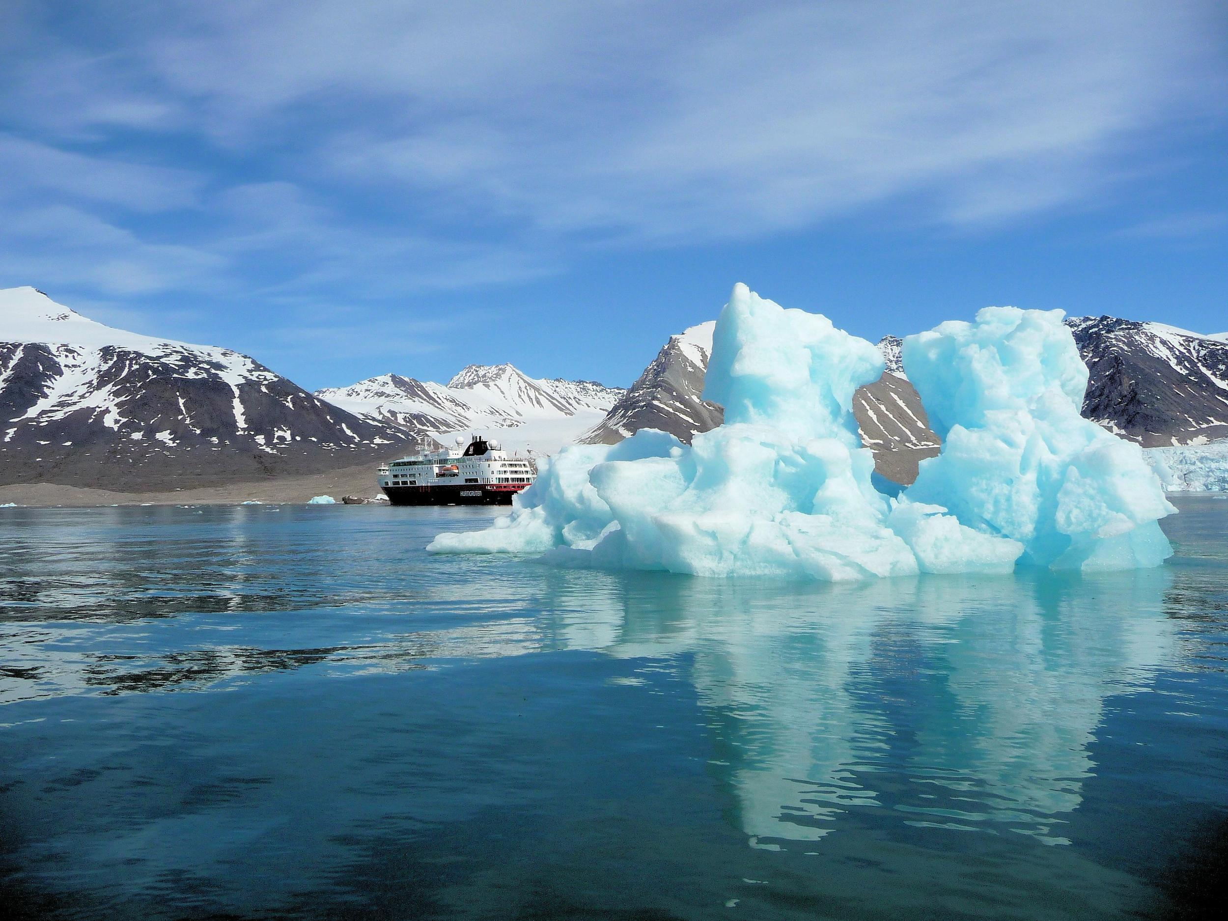 A cruise ship sails through the Arctic as global warming opens up new shipping lanes in the region