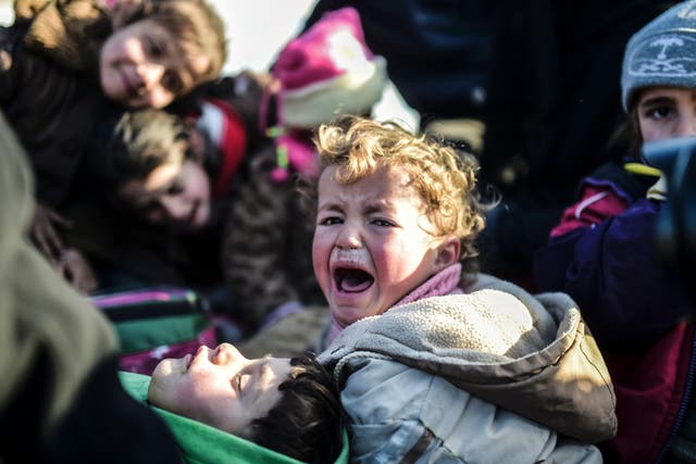 A Syrian child cries while fleeing the northern embattled city of Aleppo
