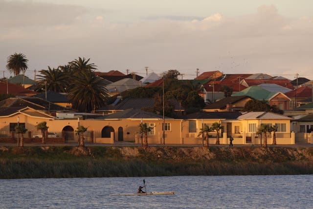 A person riding a kayak is pictured on an artificial lake near Nelson Mandela Bay Stadium in Port Elizabeth