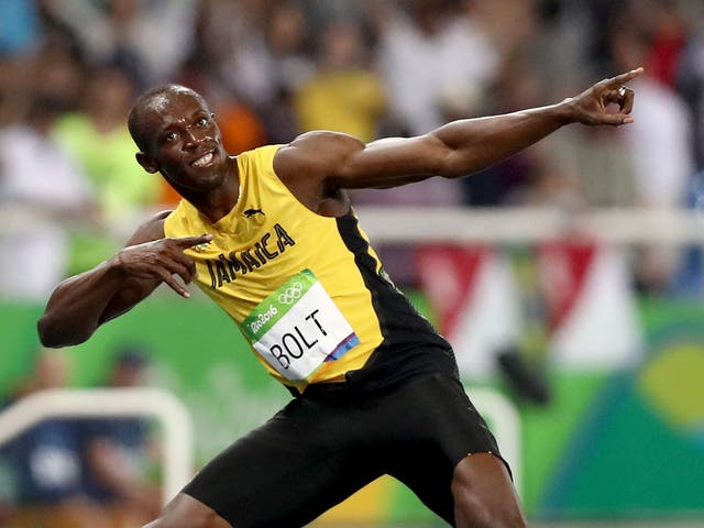 Bolt celebrates in his trademark 'lightning bolt' stance