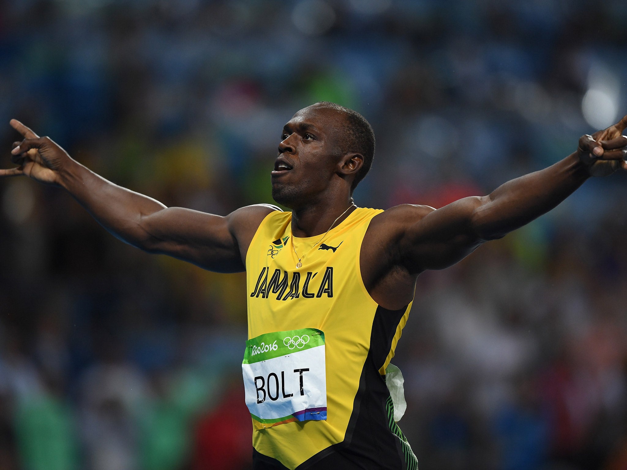 Usain Bolt celebrates victory in the men's 200m Olympic final
