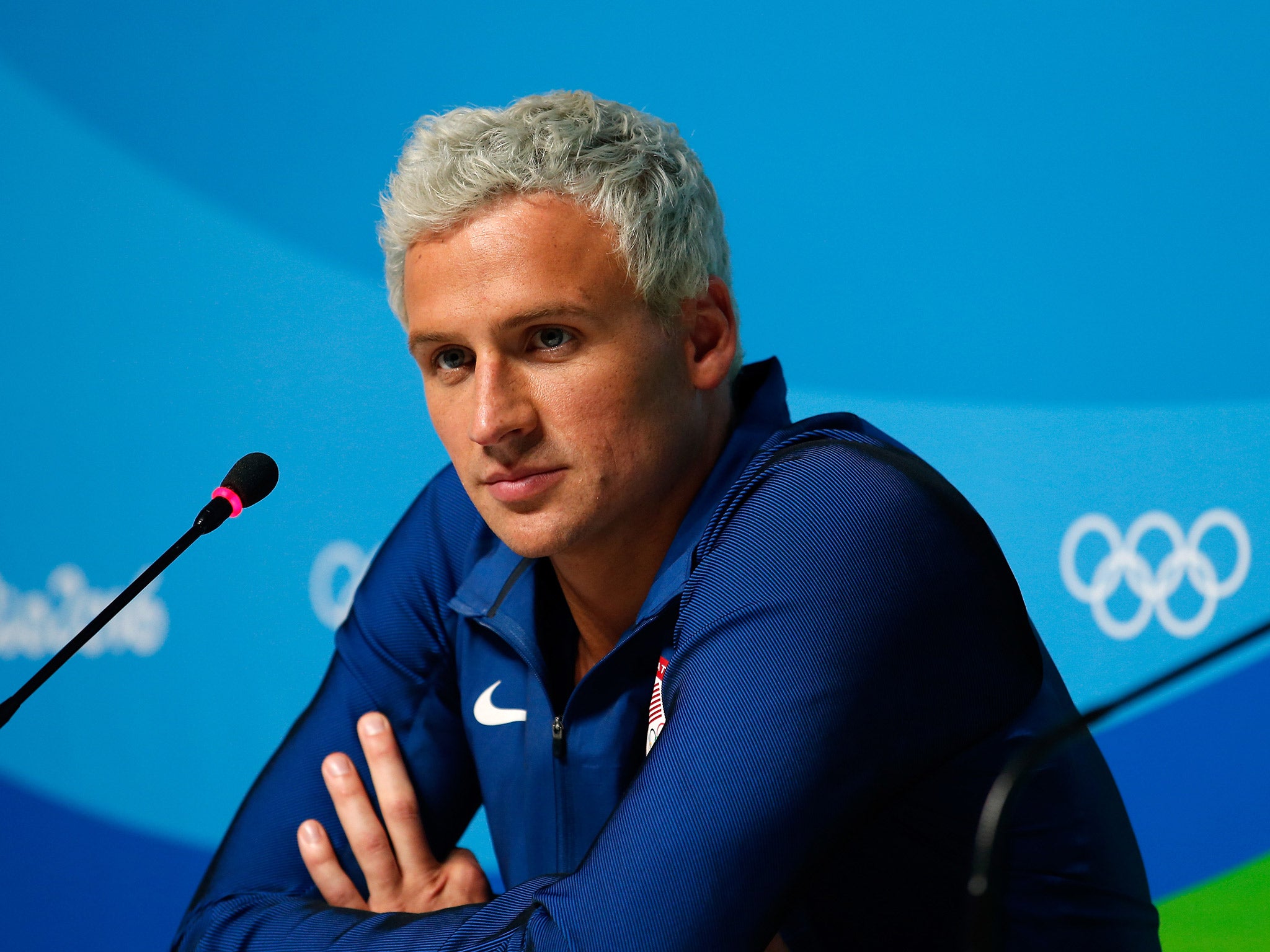 Ryan Lochte told US media that he and three teammates were the victims of an armed robbery