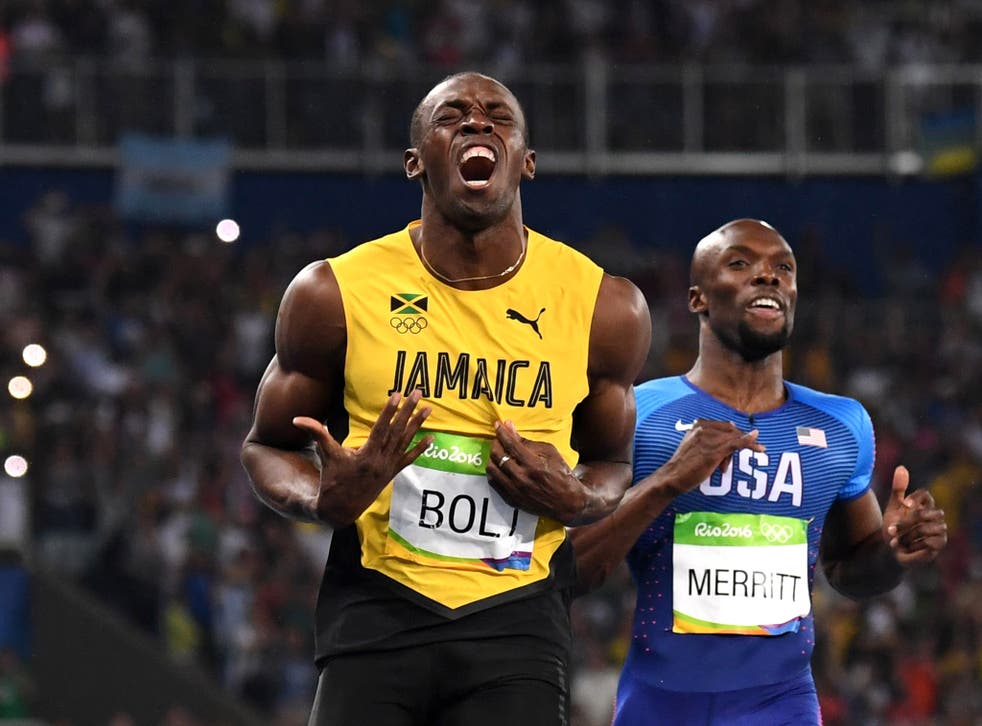 Usain Bolt reacts as he crosses the finish line to win 200m Olympic gold
