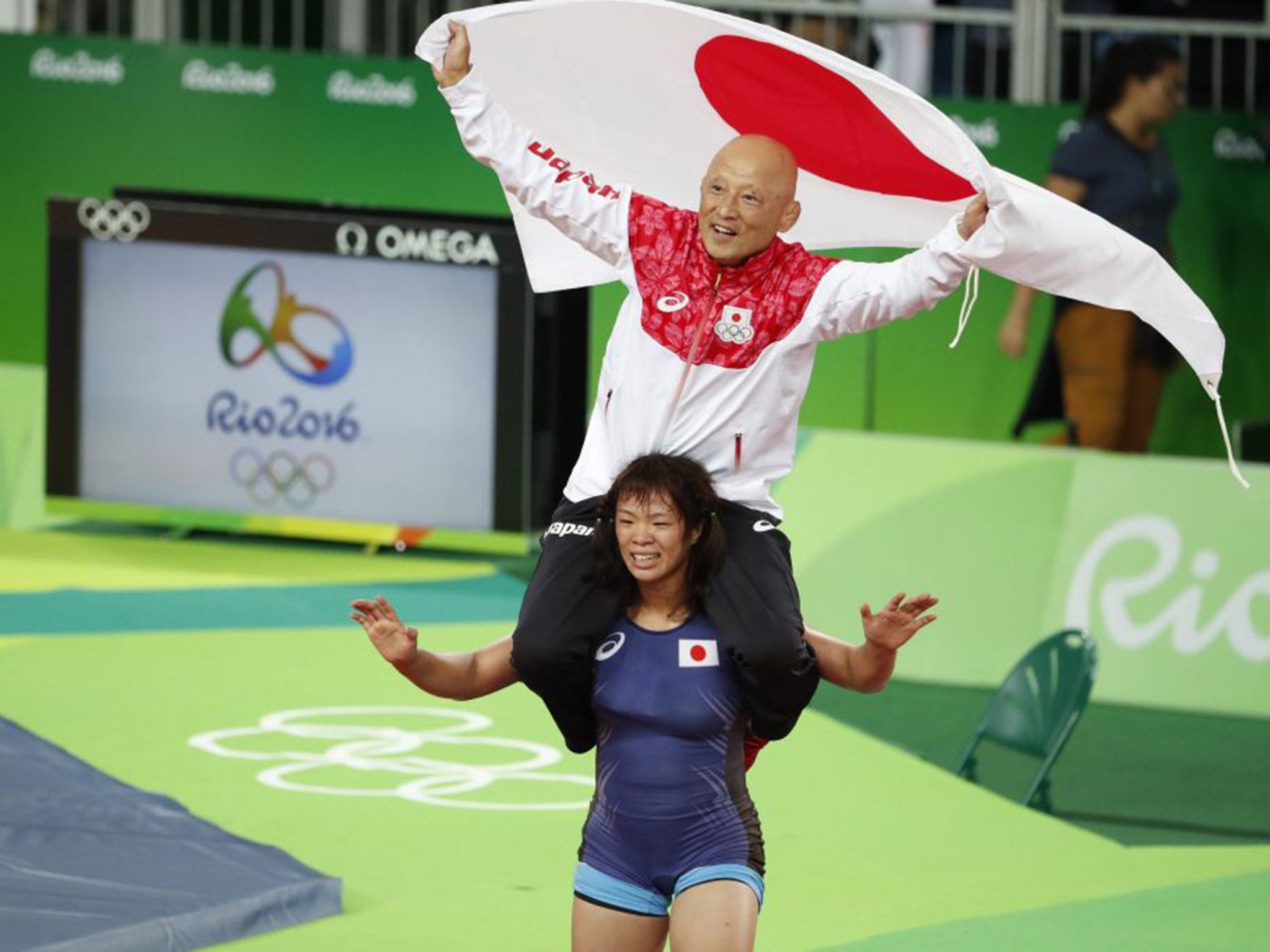 Kiwai parades her coach around the arena on her shoulders