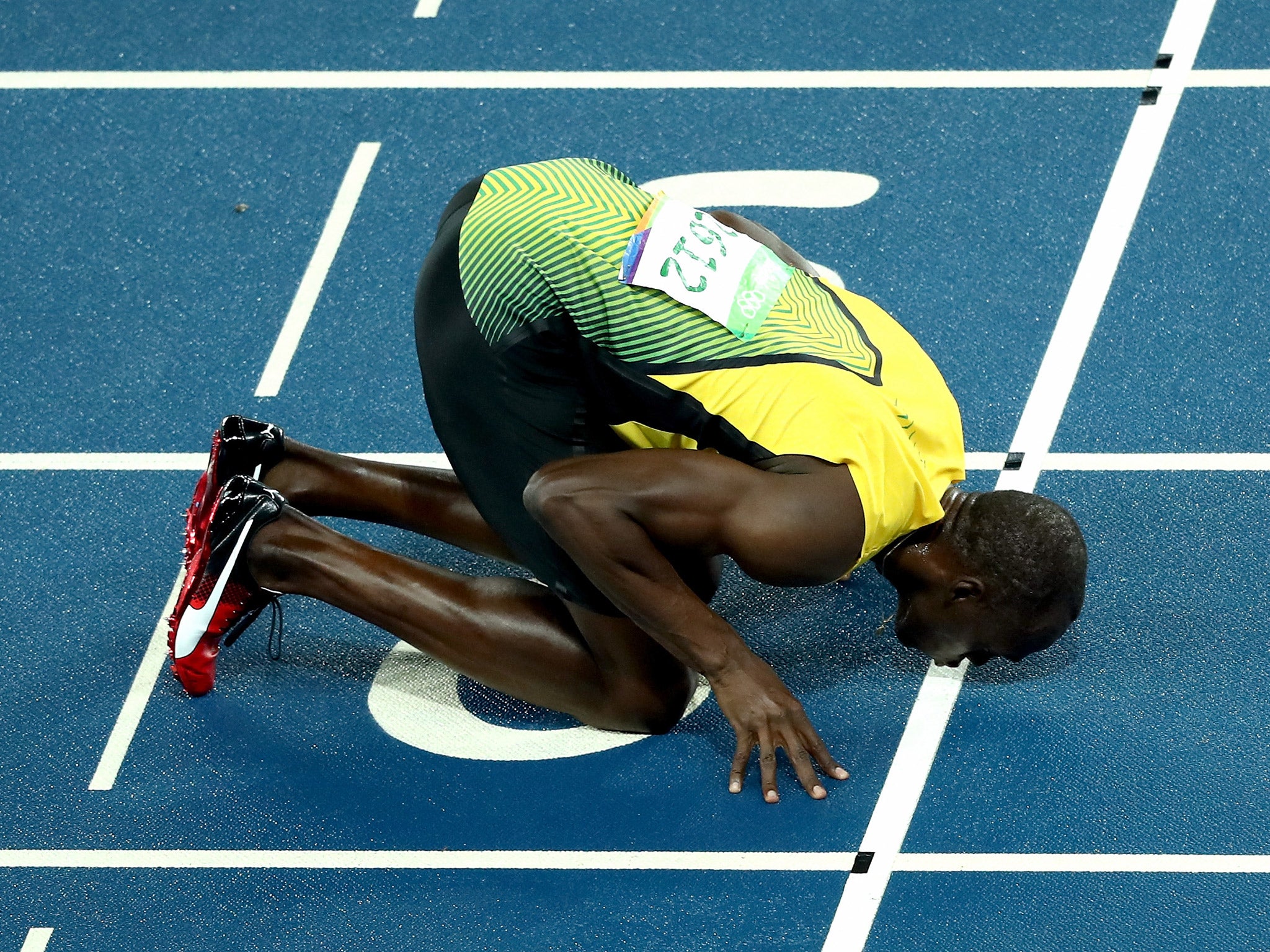 Usain Bolt kisses the finish line in his farewell to running the 200m at the Olympics