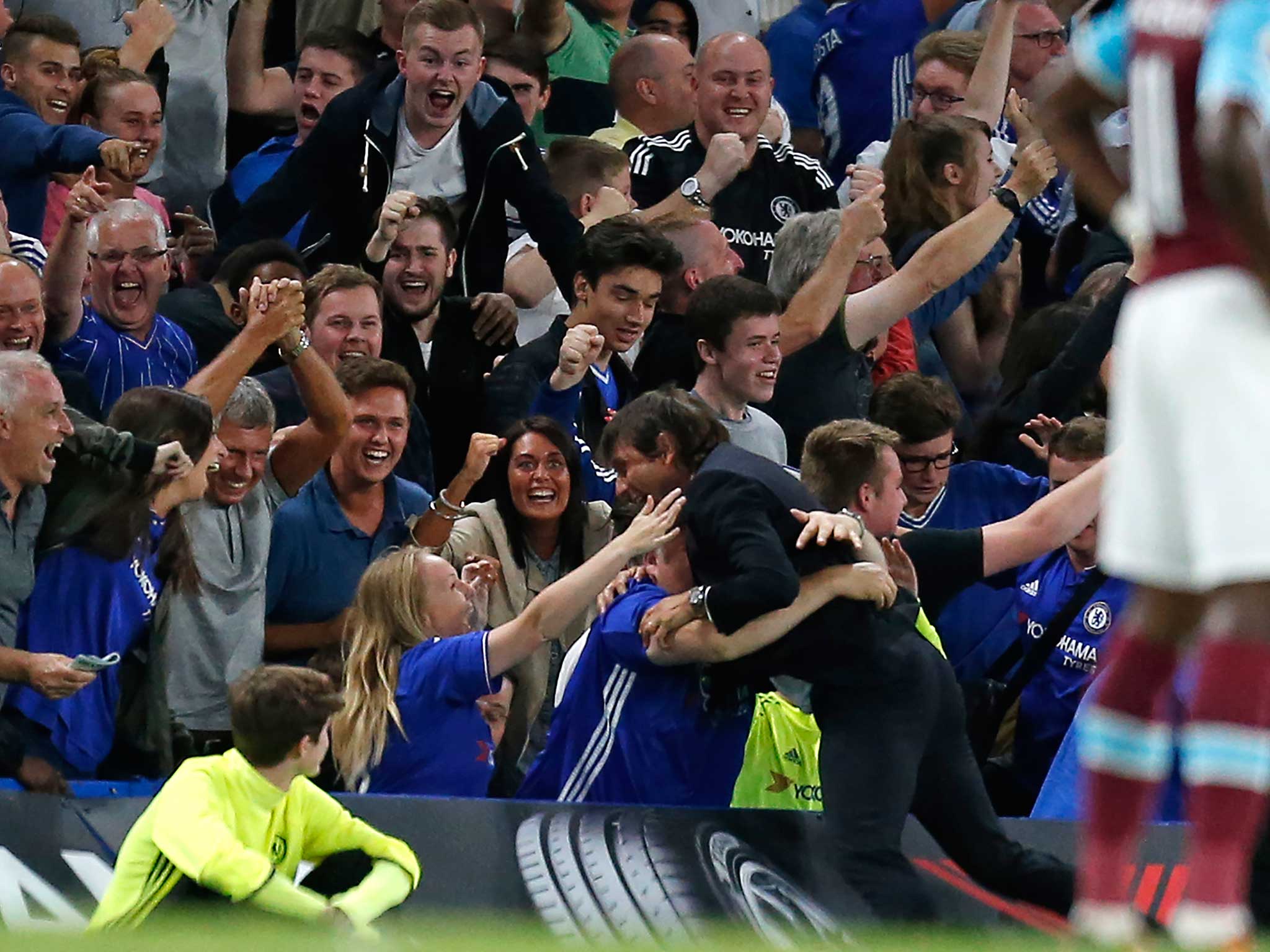 Antonio Conte dives into the Stamford Bridge crowd during the victory against West Ham