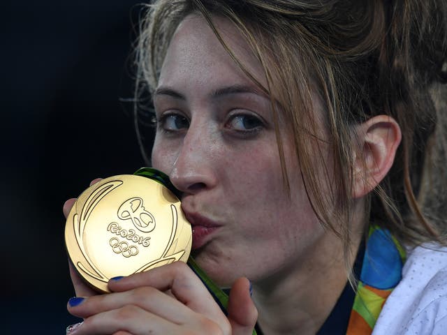 Jones poses with her second Olympic gold medal