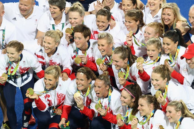 Team Great Britain pose with their gold medals after defeating the Netherlands