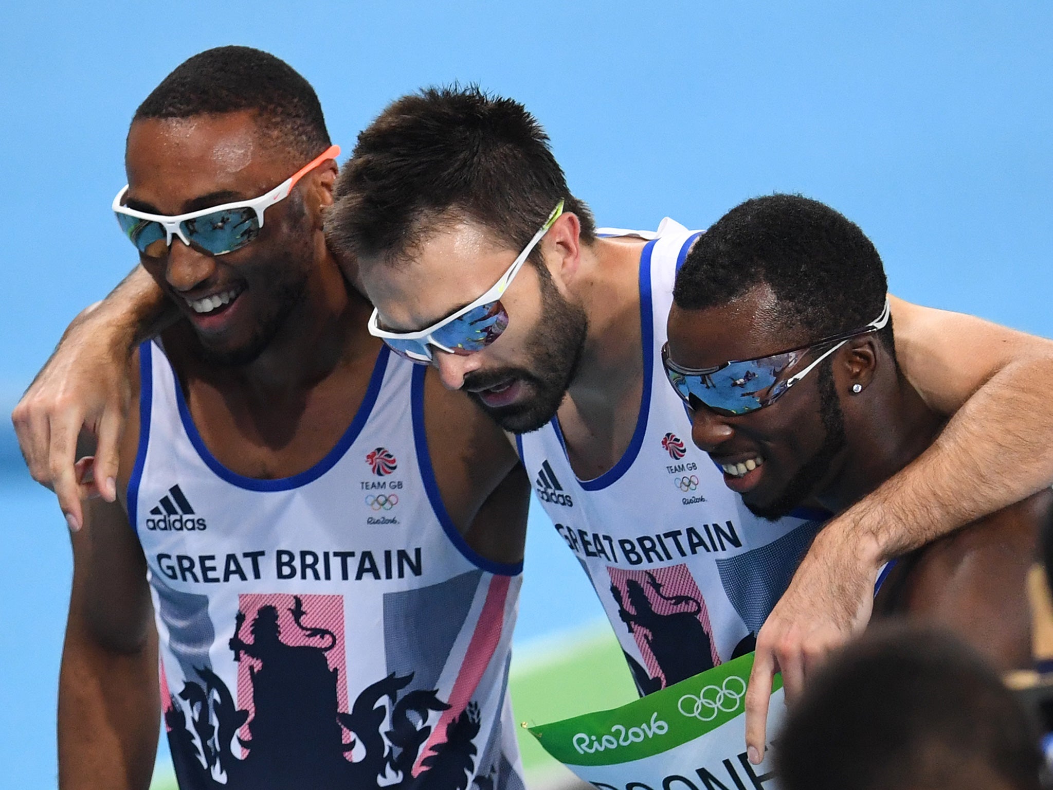 Britain's Matthew Hudson-Smith (left), Martyn Rooney (centre) and Nigel Levine react after competing in the men's 4x400m relay